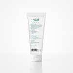 A white squeeze tube of Vibit Topical Gel, showing the back label with text and a barcode, set against a clean white background with a soft reflection.